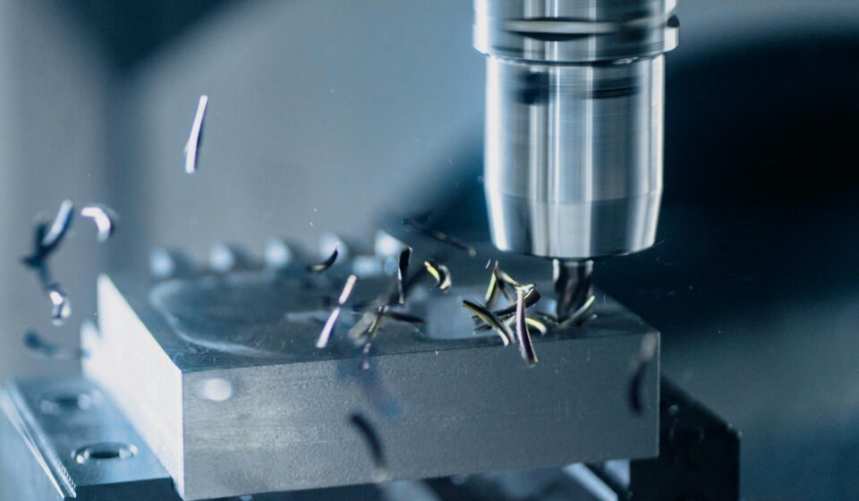 Close-up of a CNC milling machine working on metal for precise manufacturing.